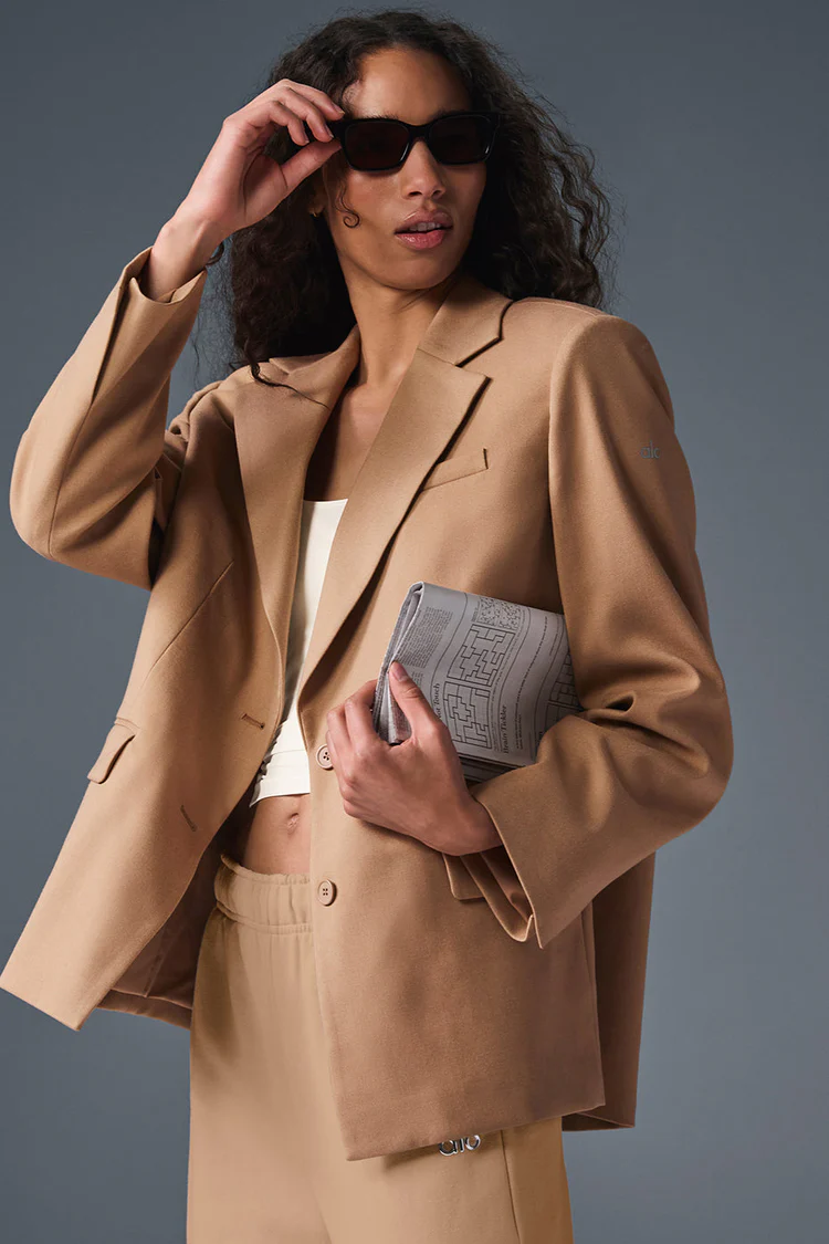 Lightweight camel blazer with matching trousers on a model