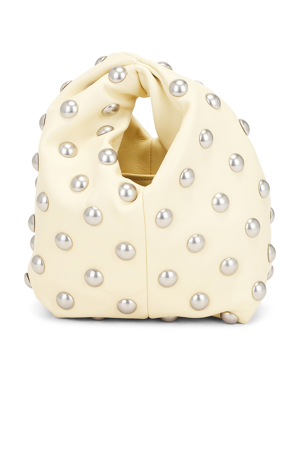 Off white leather rounded bag with silver circles.