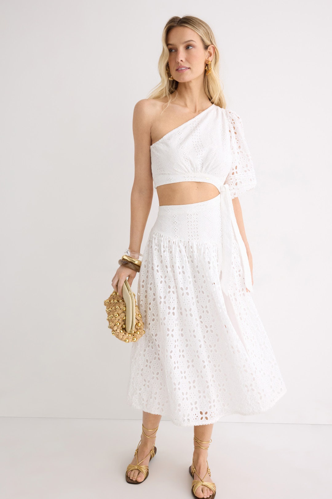 White one shoulder cutouts midi dres on a model.