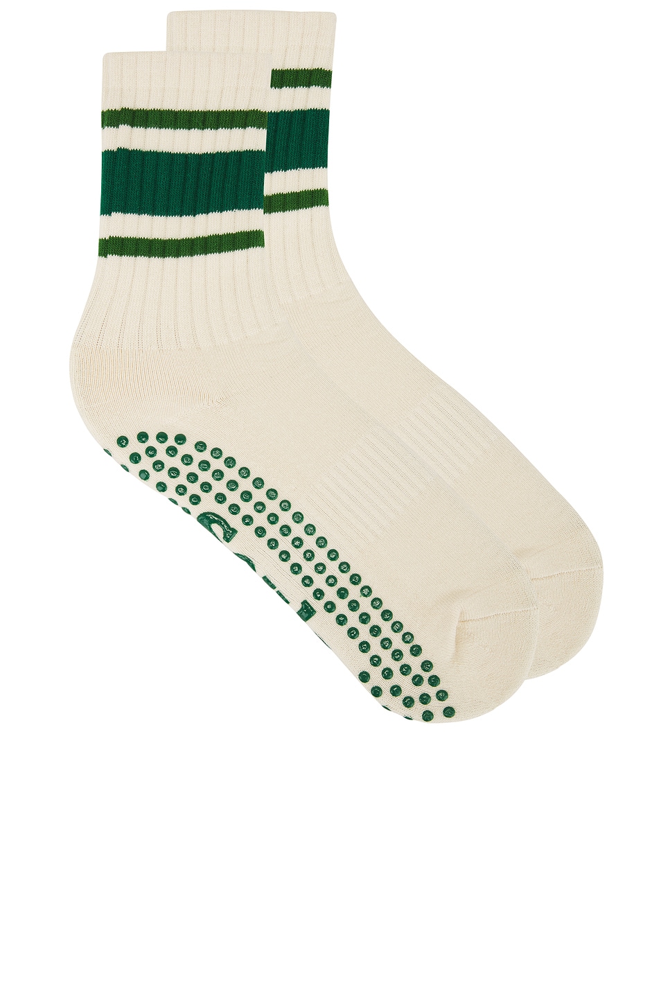 Off white pilates crew socks with forest green stripes and circle grips.