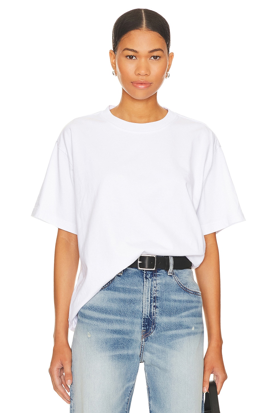 White t-shirt tucked in on a model.