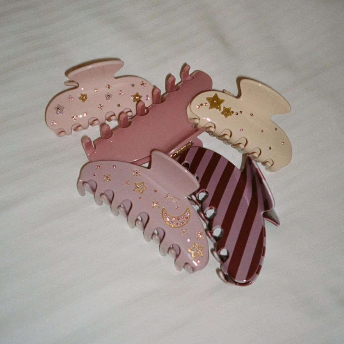 Pink, cream, and purple Emi Jay hair clips
