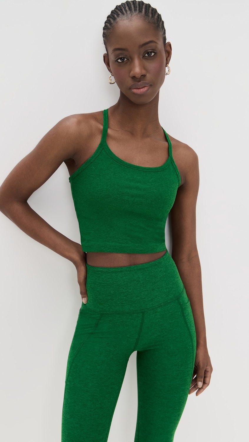 Green heather tank top on a model.