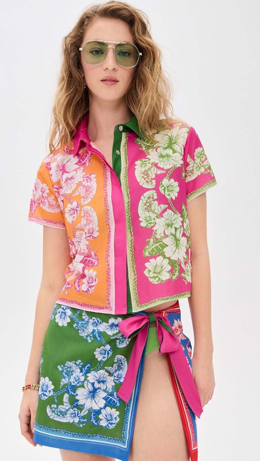 Multicolored floral button-up short sleeve top with matching wrap skirt coverup on a model.
