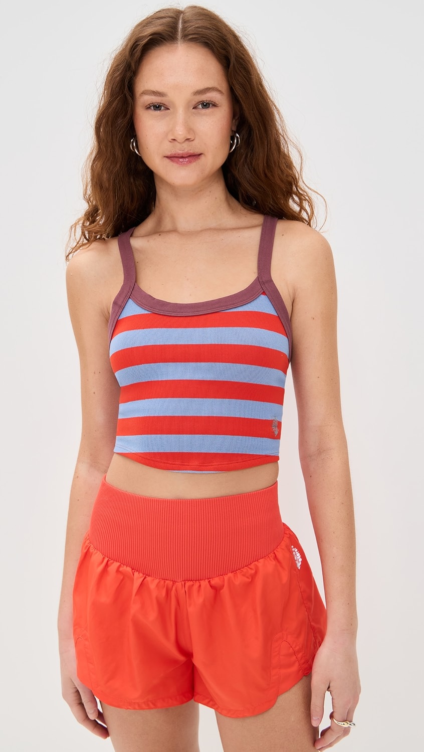 Red and blue striped tank top with purple trim on a model.
