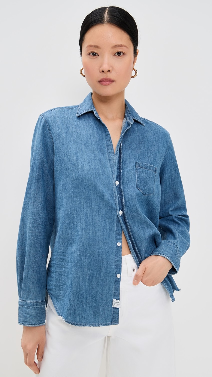 Blue button up denim shirt on a model.