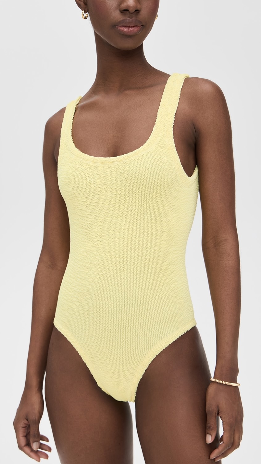 White terry cloth one piece swimsuit on a model.