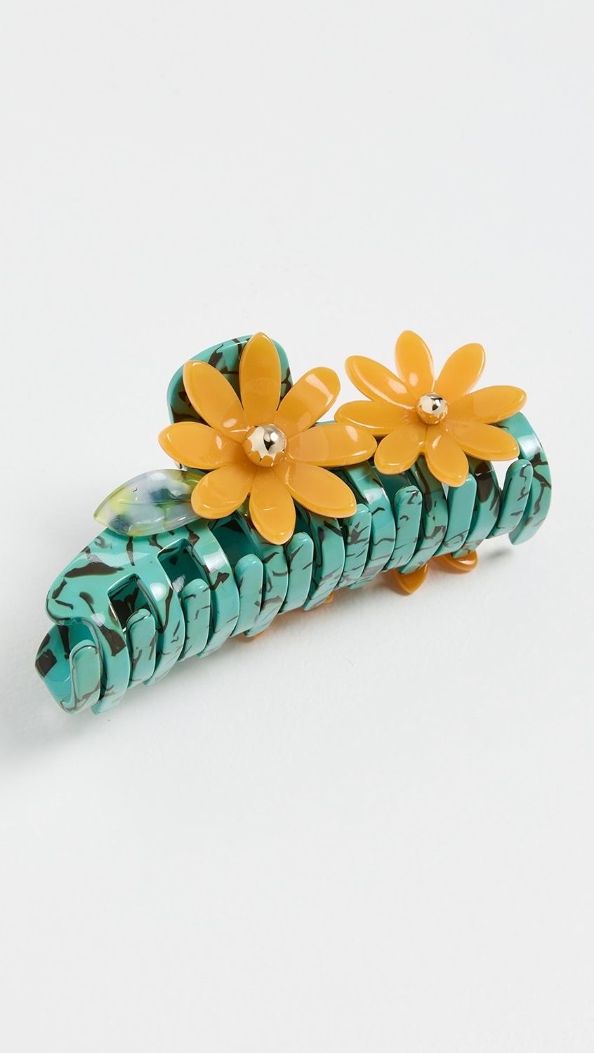 Neon turquoise tortoise claw clip with yellow flowers,