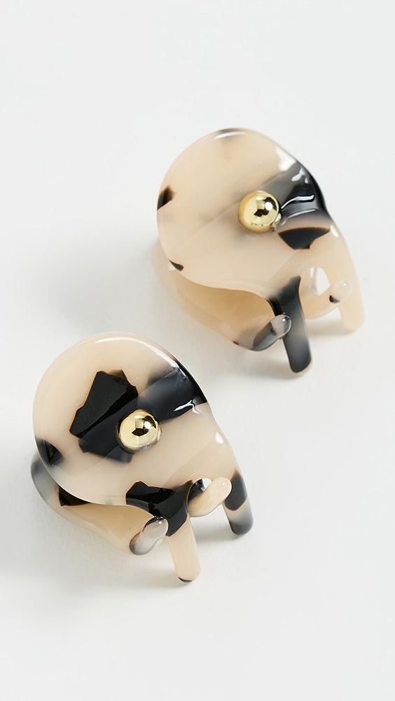 Light brown tortoise shell mini hair clips with gold details.