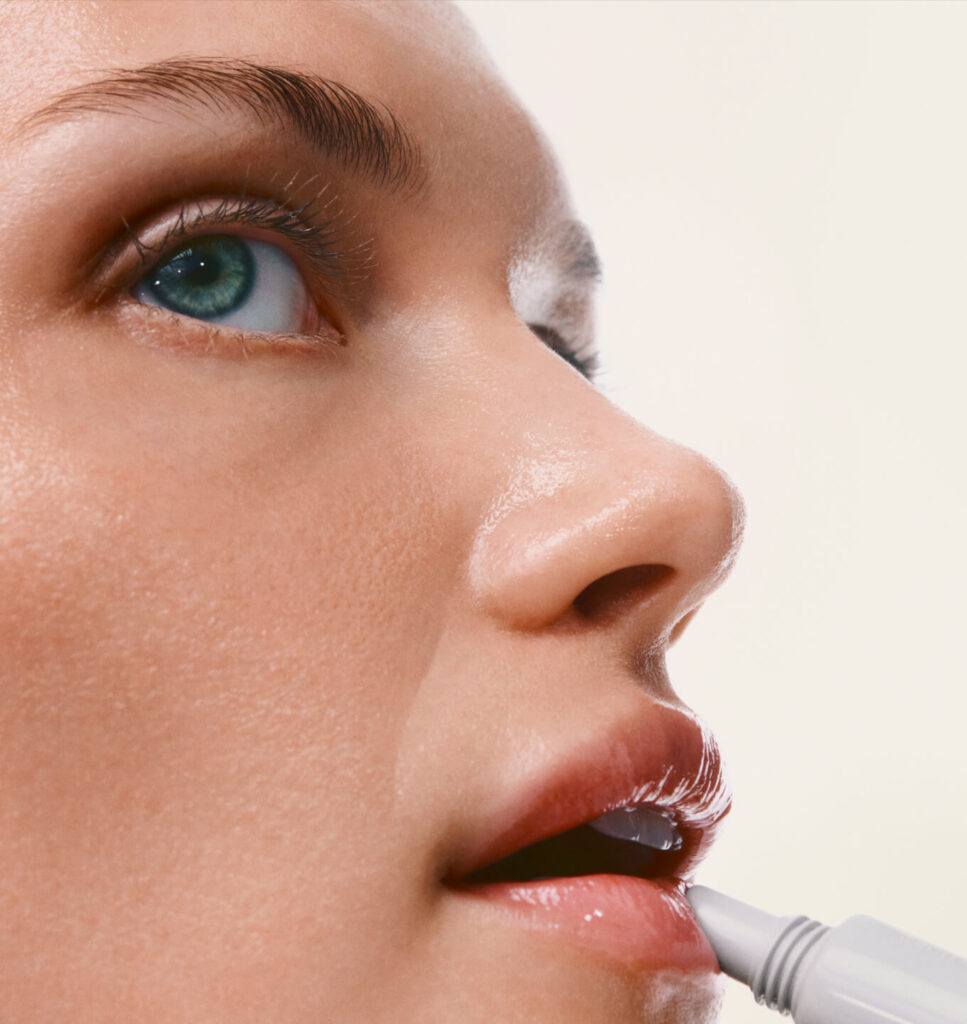 Rhode Watermelon Slice Peptide Lip Treatment being applied to lips, which is step five of a summer glow-up