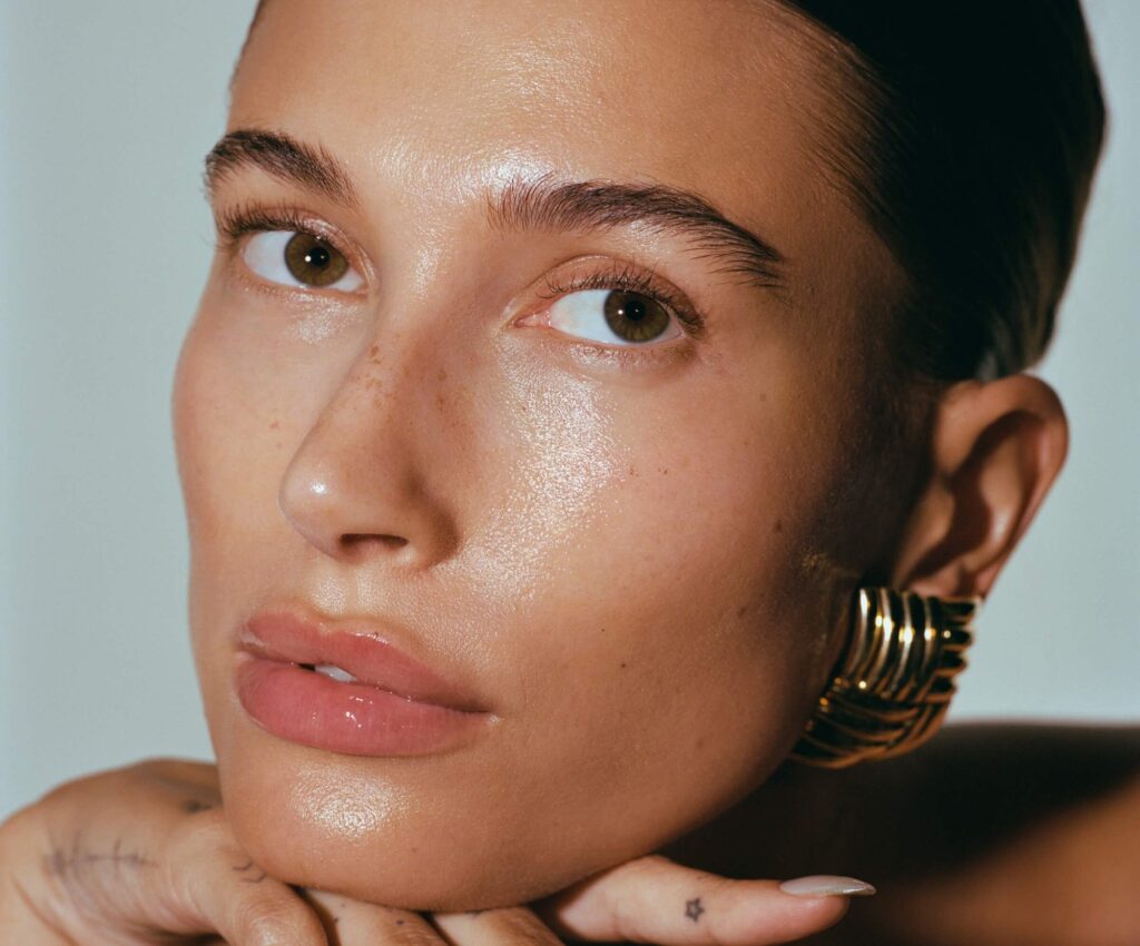 Hailey Bieber with Rhode products applied