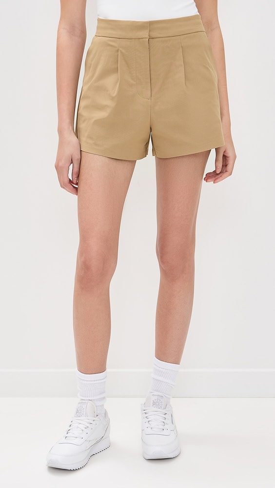 Khaki tailored trouser shorts on a model.