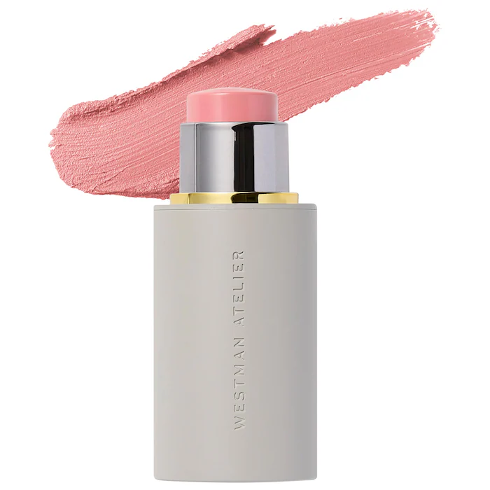 Cream blush stick with pink smear.
