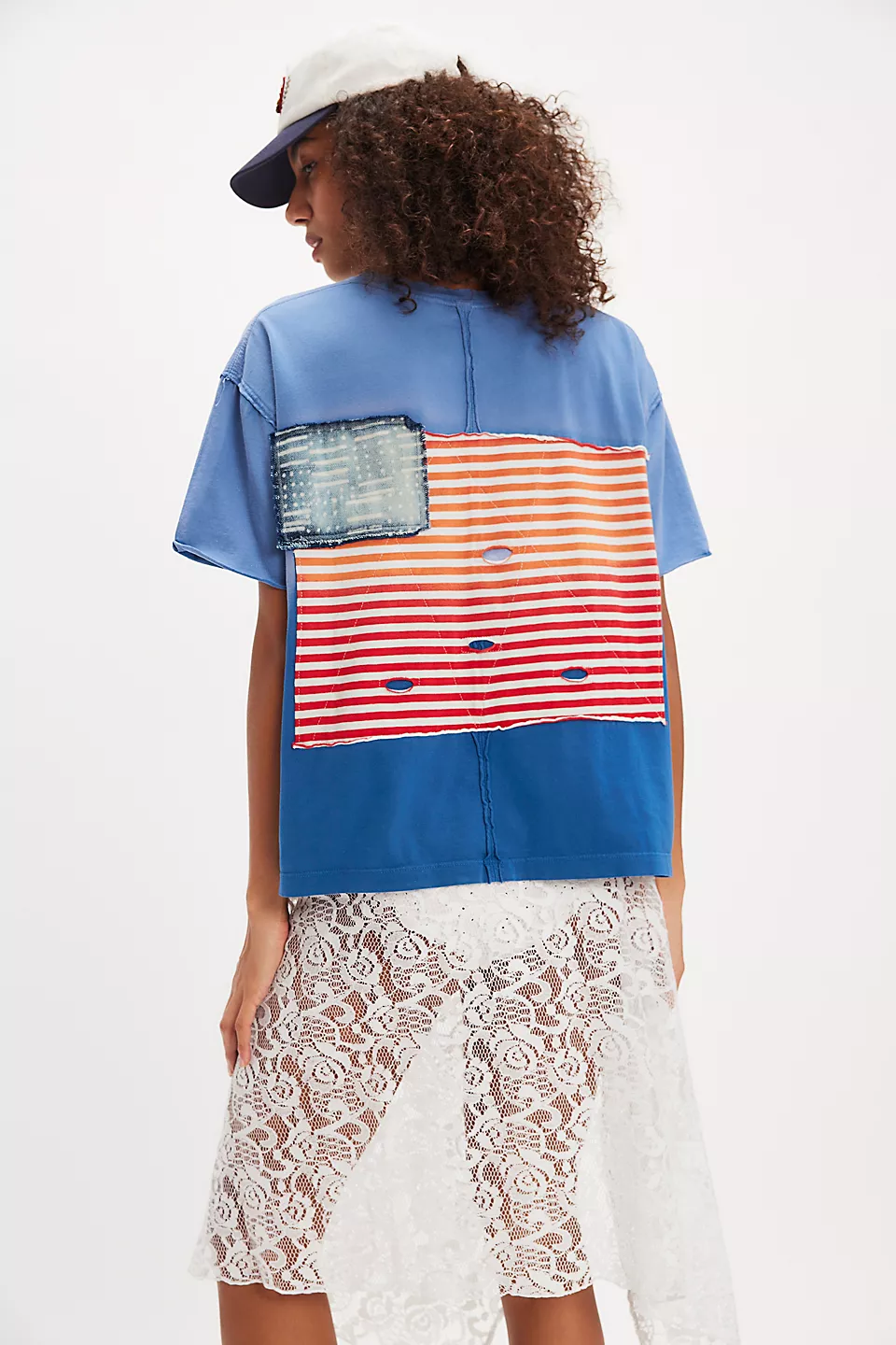 Blue ombré t shirt with U.S. flag on the back on a model.