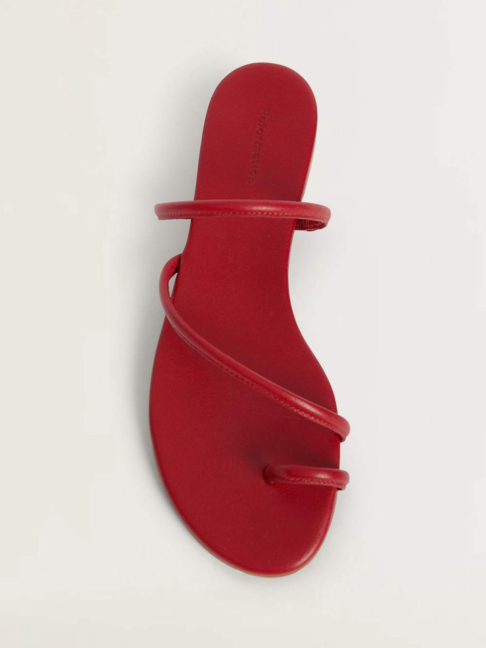 Red scrappy leather sandals.