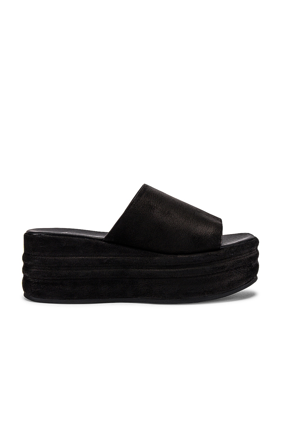 Black platform sandals, which is one of the work from home essentials.