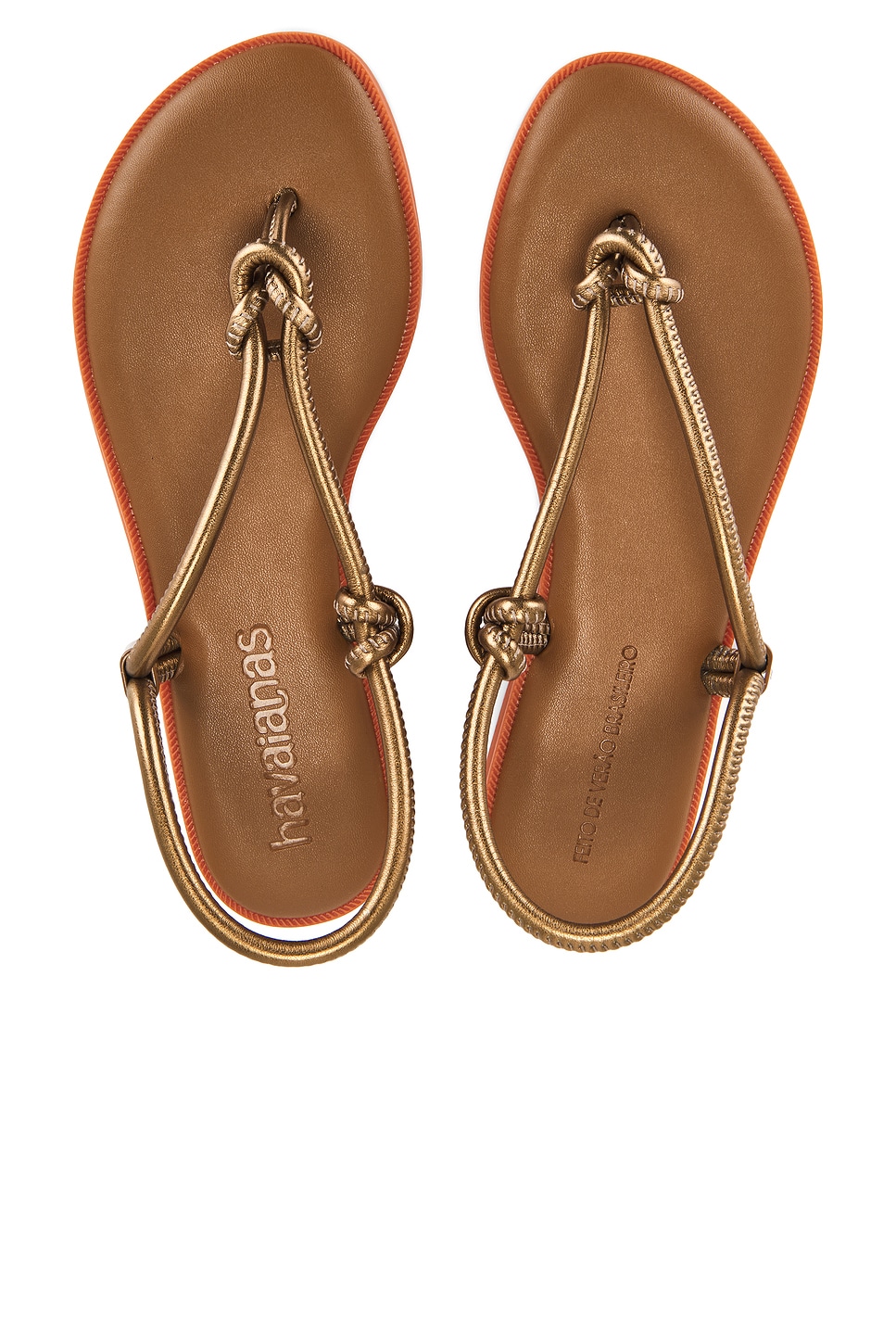 Brown shiny sandals.