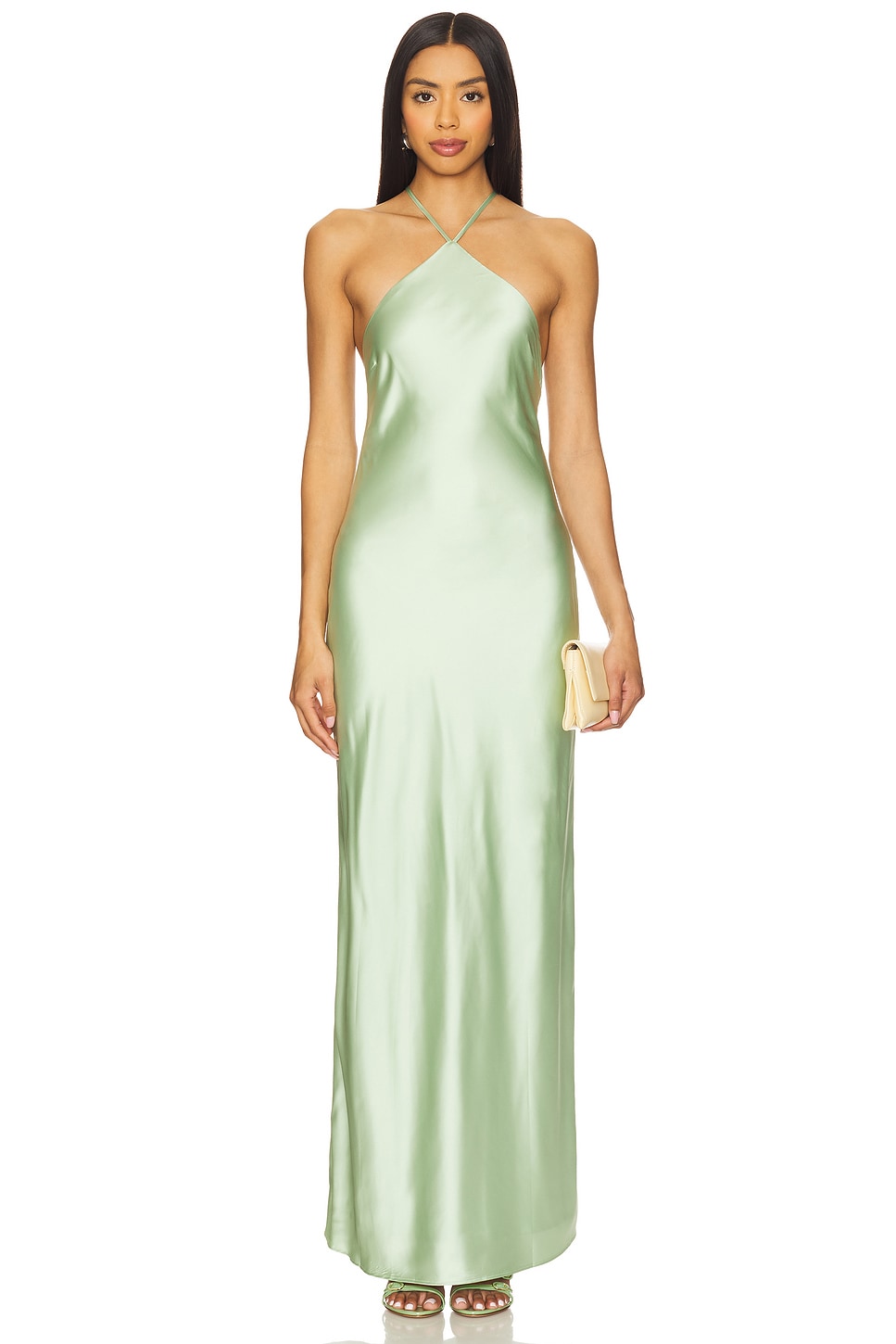 Silky green halter gown on a model, which is one of the wedding guest dresses.