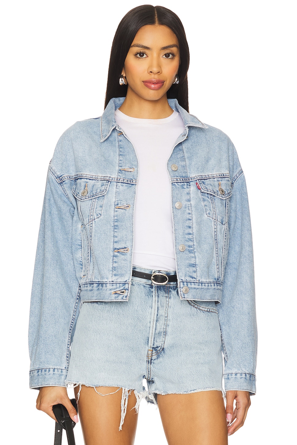 Cropped light blue boxy denim jacket on a model.