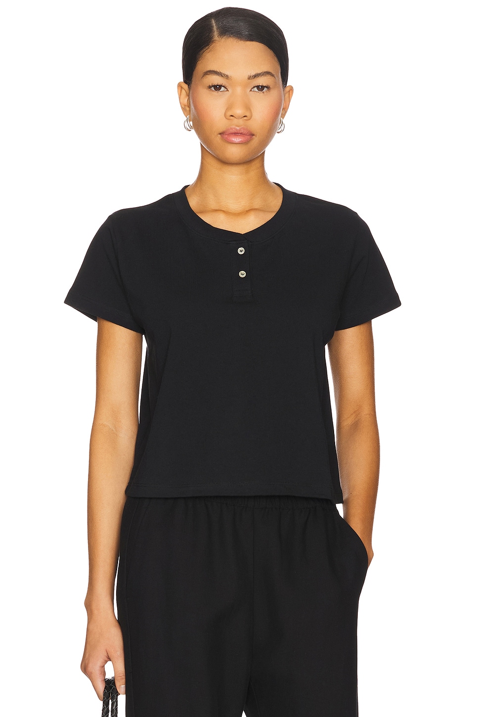Black henley t shirt on a model.