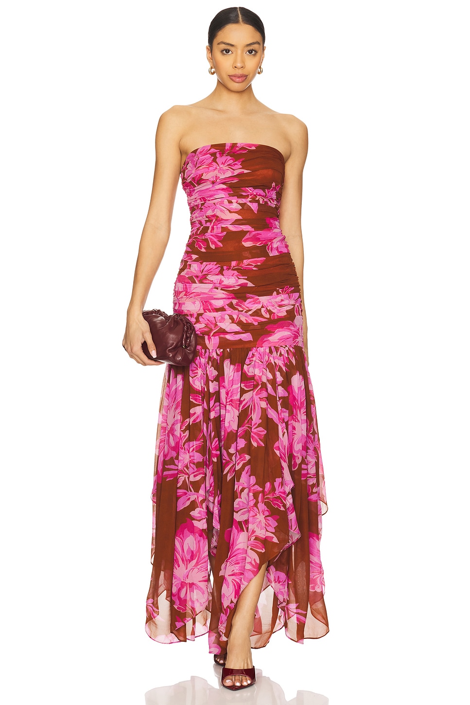 Maroon and pink floral strapless gown on a model.
