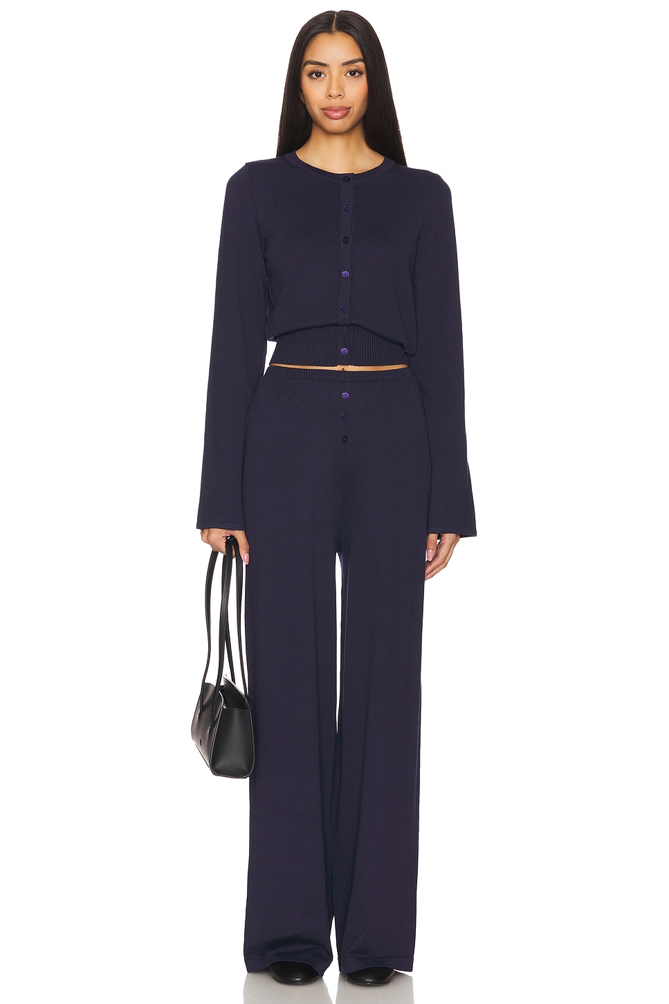 Navy cinched cardigan and matching pants on a model.
