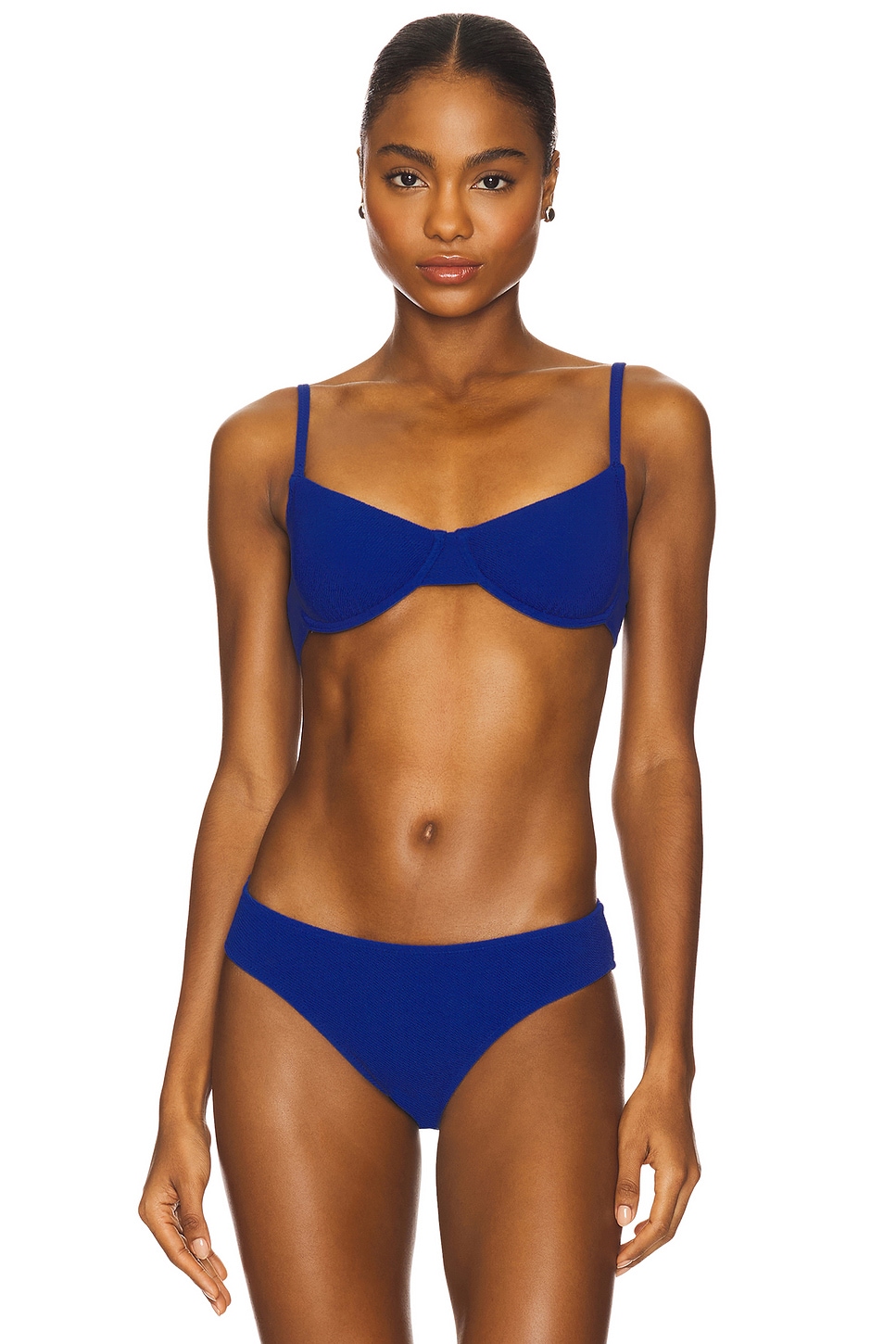 Deep blue underwire bikini on a model.