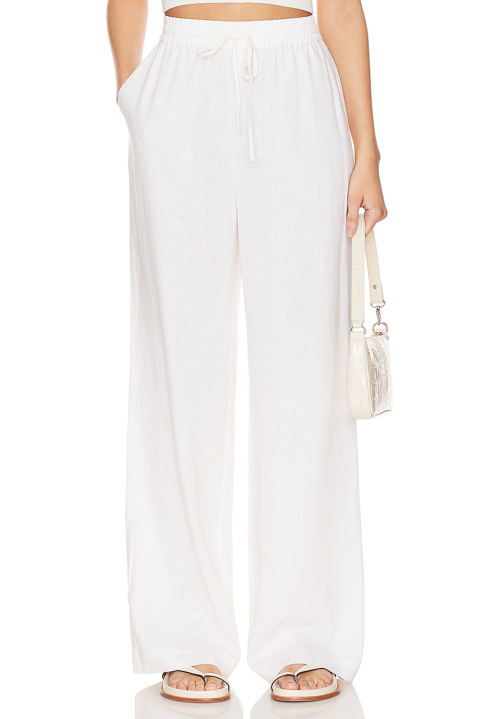 White linen pants on a model.