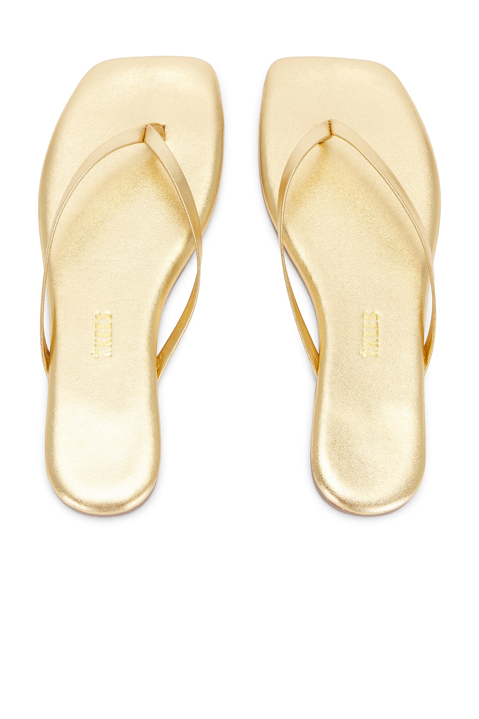 Gold shiny square toe flip flops, which is one of the stylish shoes.