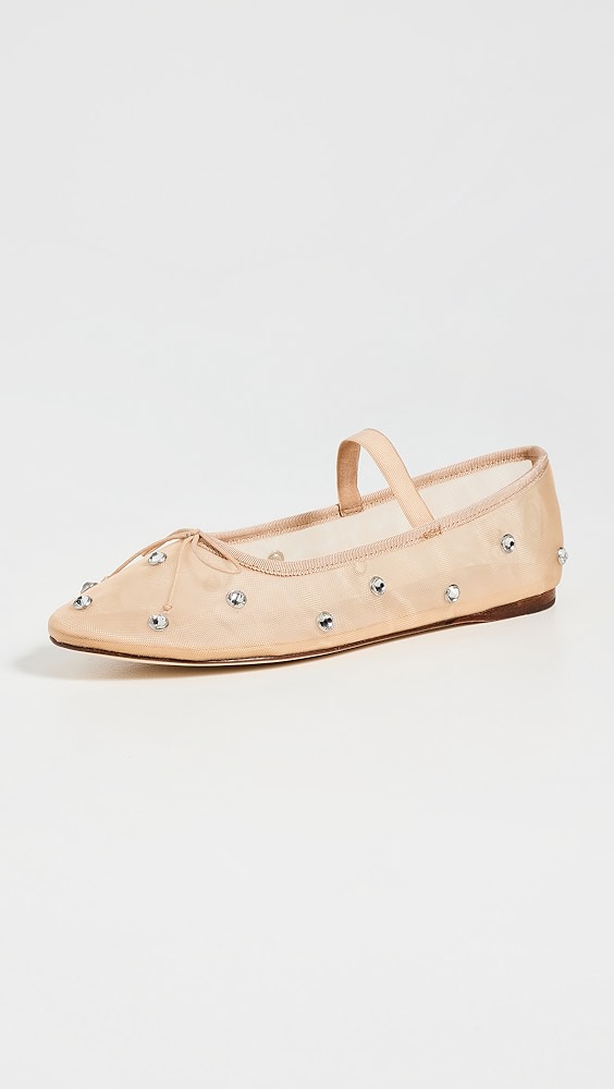 Nude sheer shoe with silver rhinestones and a strap.