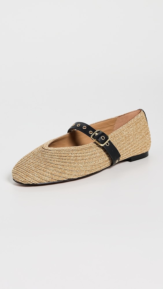 Tan woven shoe with a black leather strap.
