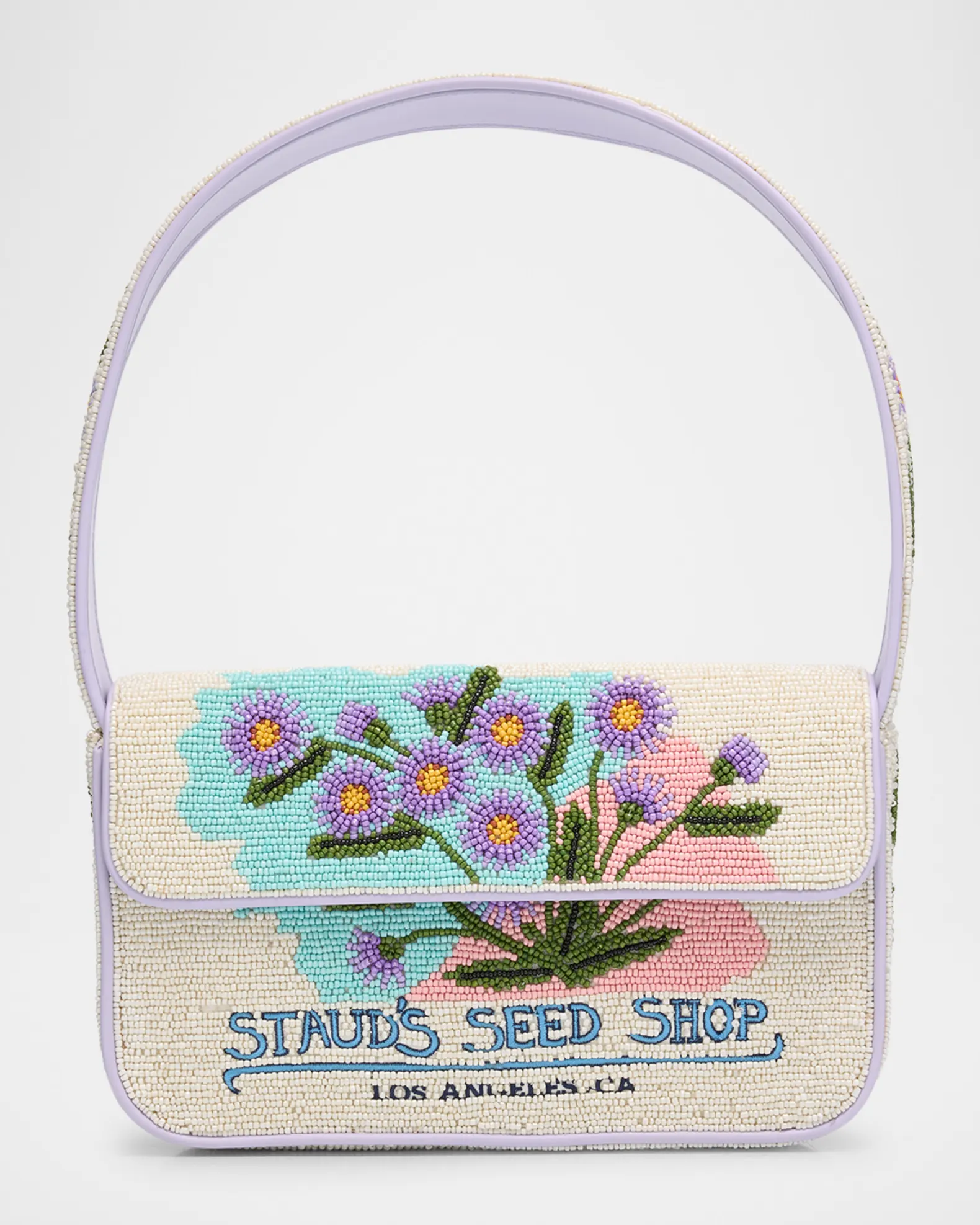 Off white and purple beaded purse with blue, pink, and purple flower designs, and text that says "STAUD'S SEED SHOP."