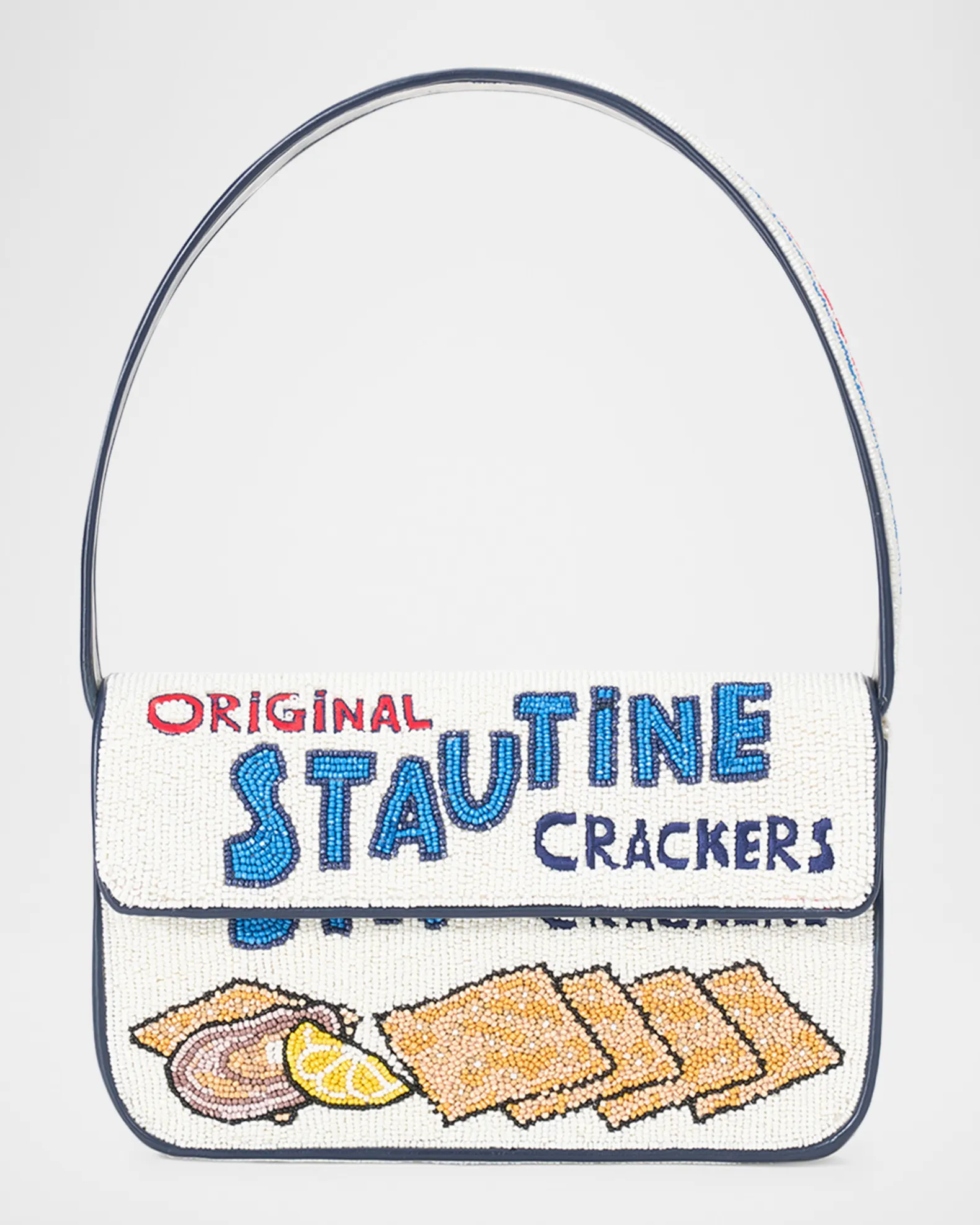 White and navy beaded purse with saltine, oyster, and lemon deigns, and text that says "ORIGINAL STAUTINE CRACKERS."