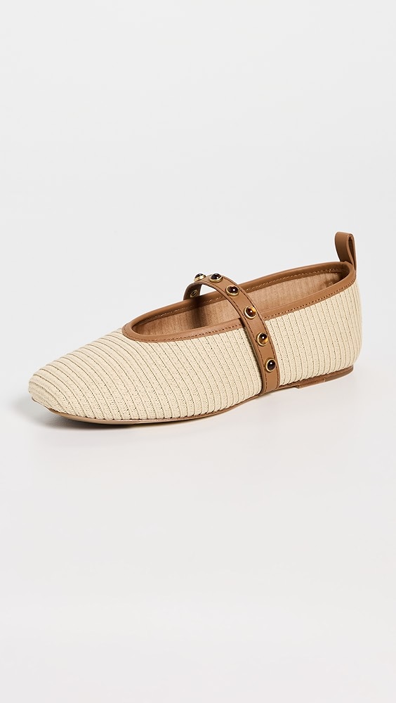 Light tan woven ballet flats with a tan leather strap and brown embellishments.