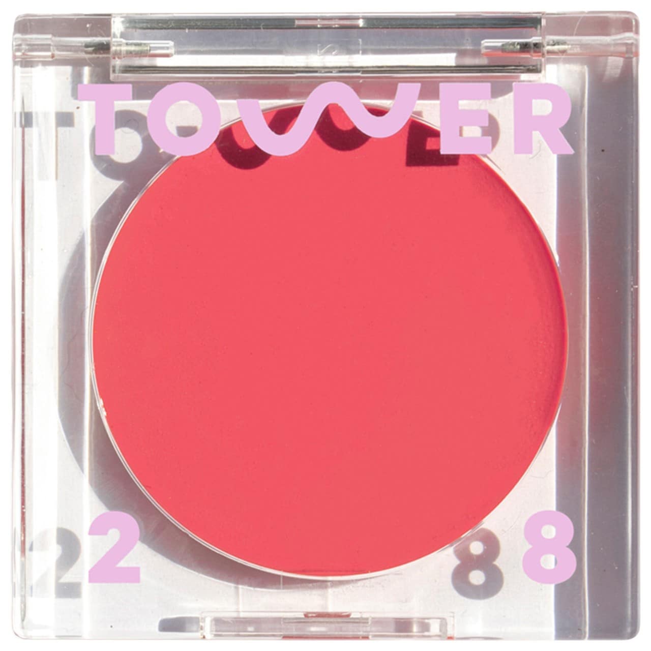 Clear Tower 28 container with bright pinkish red lip and cheek cream blush.
