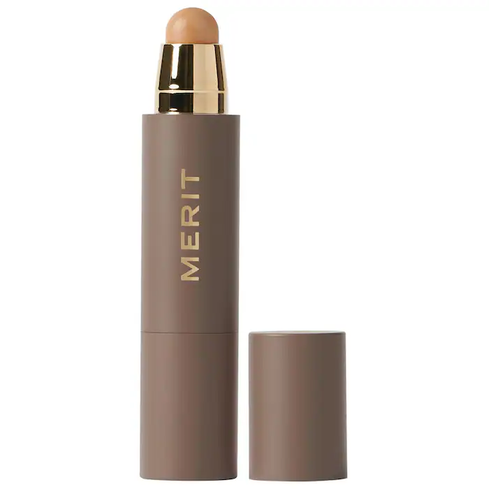 Brown and gold MERIT stick with tan foundation/concealer.