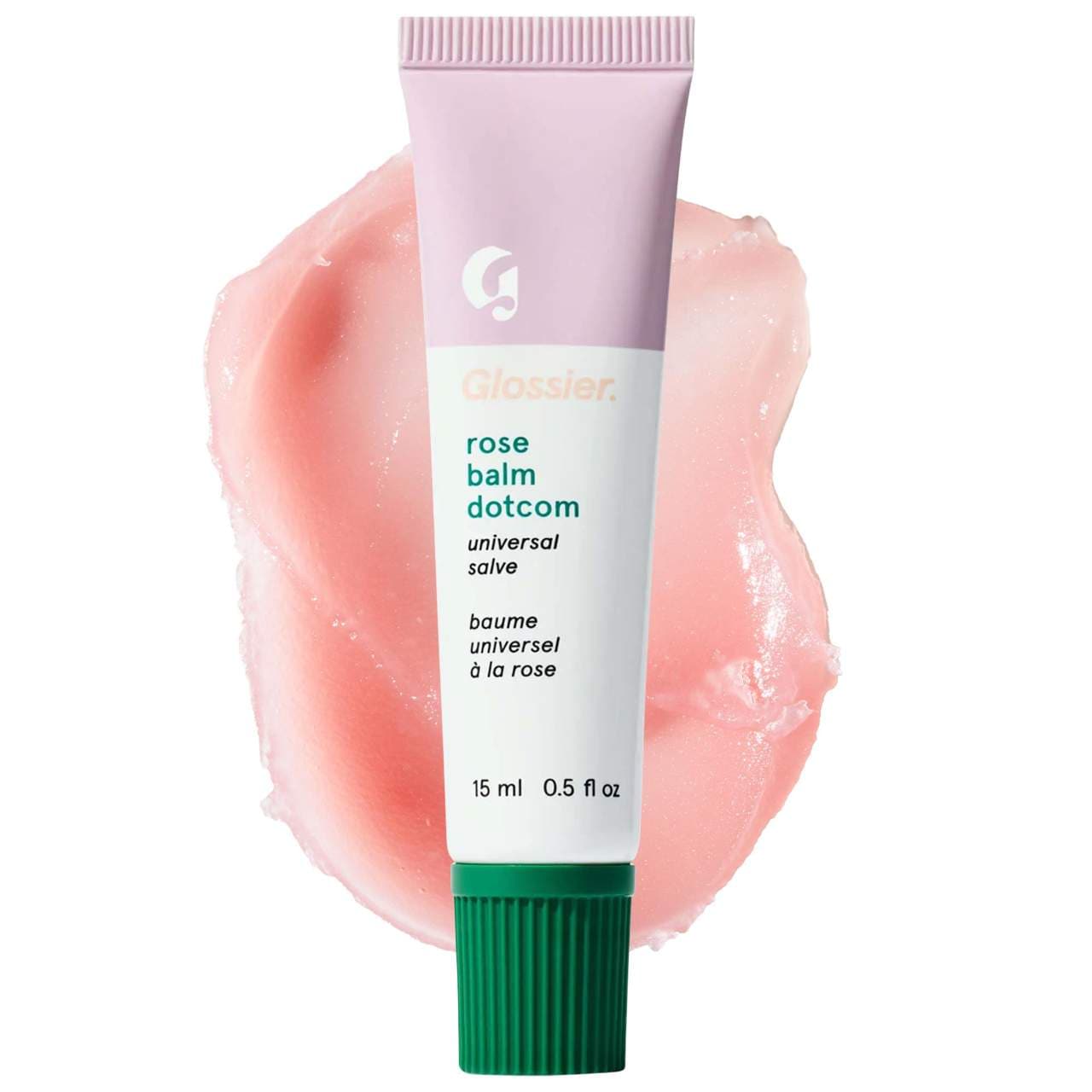 White, light purple, and green Glossier tube with a light pink balm and skin salve swatch, which is one of the summer beauty products.