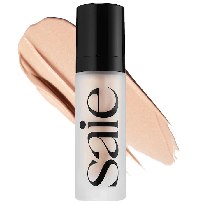 Clear and black Saie bottle with a tan illuminator swatch.