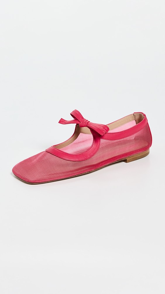 Pink sheer and open cutout shoe with a bow strap.