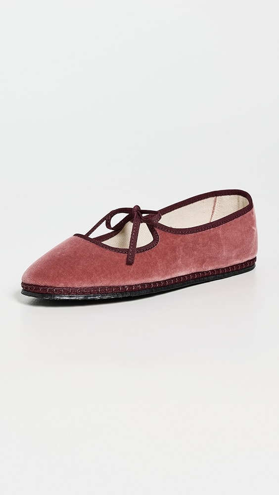 Dark pink and maroon two-tone ballet flats with a cutout and bow strap.